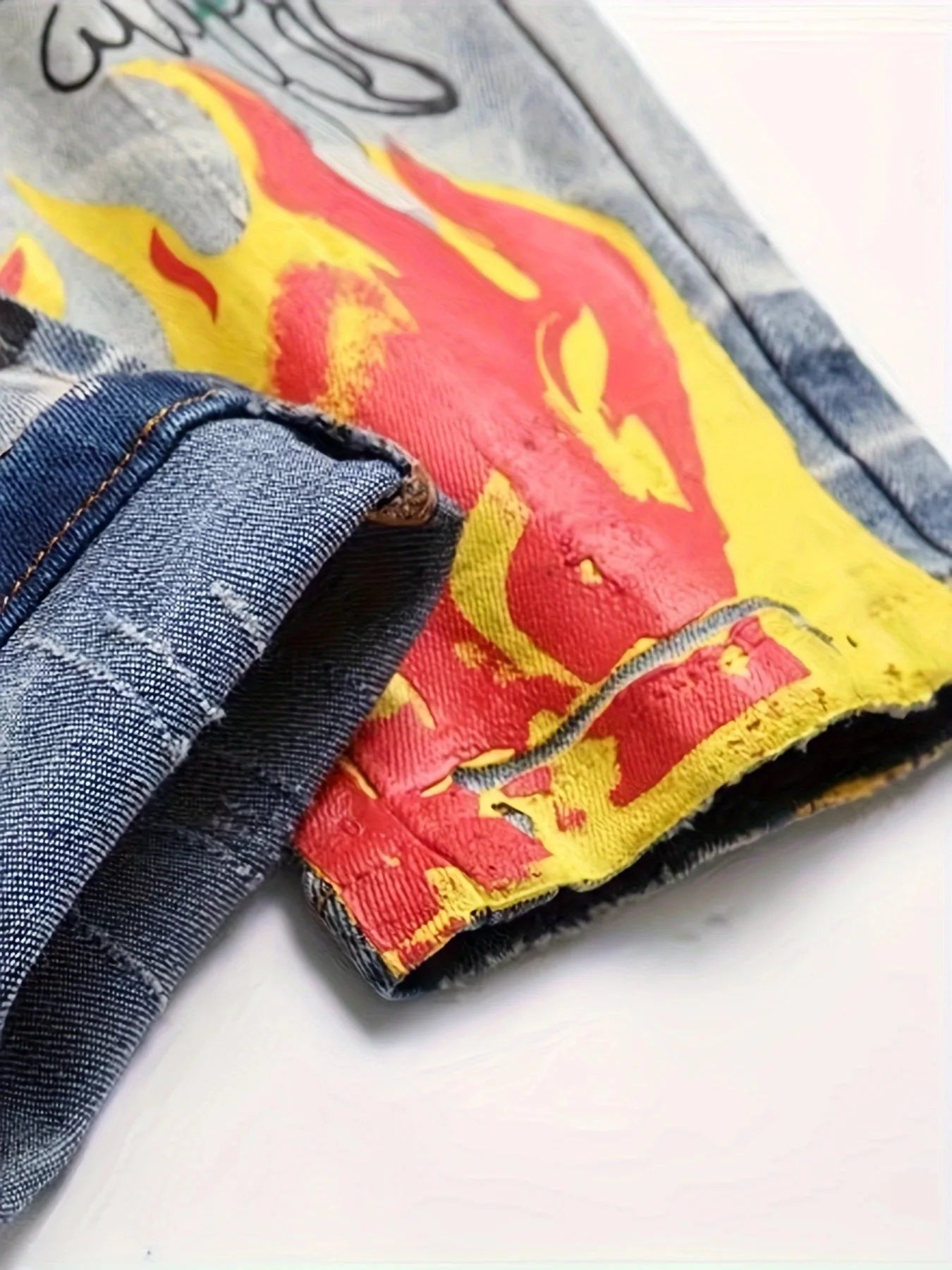 printed graffiti old washed and ripped jeans