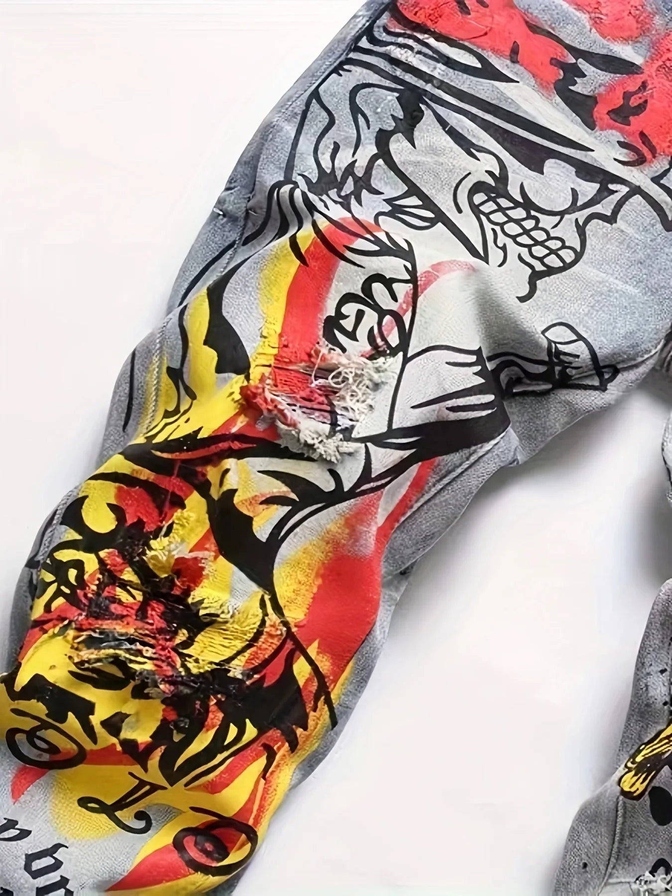 printed graffiti old washed and ripped jeans